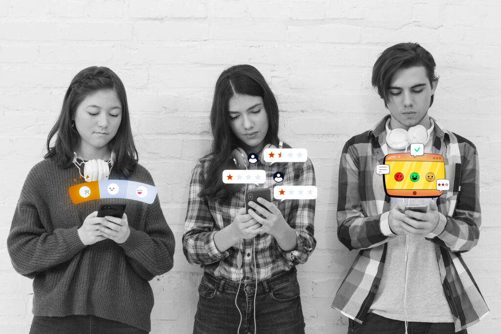 Three young people using smartphones, each displaying digital icons for feedback, reviews, and social reactions, symbolizing user-generated content and online engagement.